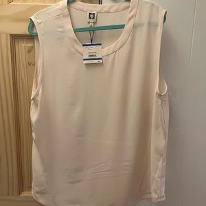 Sleeveless cream color scoop neck top. Never worn